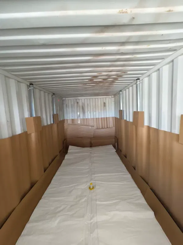 Flexibag bladder installed and spread inside the 20ft container with cardboard protection in place