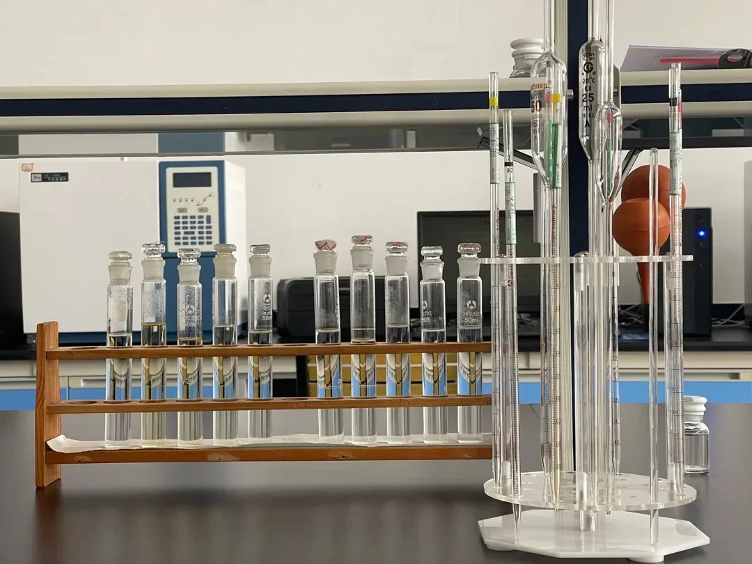 Quality control laboratory technician analyzing DOTP sample using gas chromatography equipment