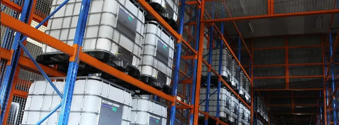 Modern warehouse facility with organized storage of chemical products in sealed containers and proper ventilation systems